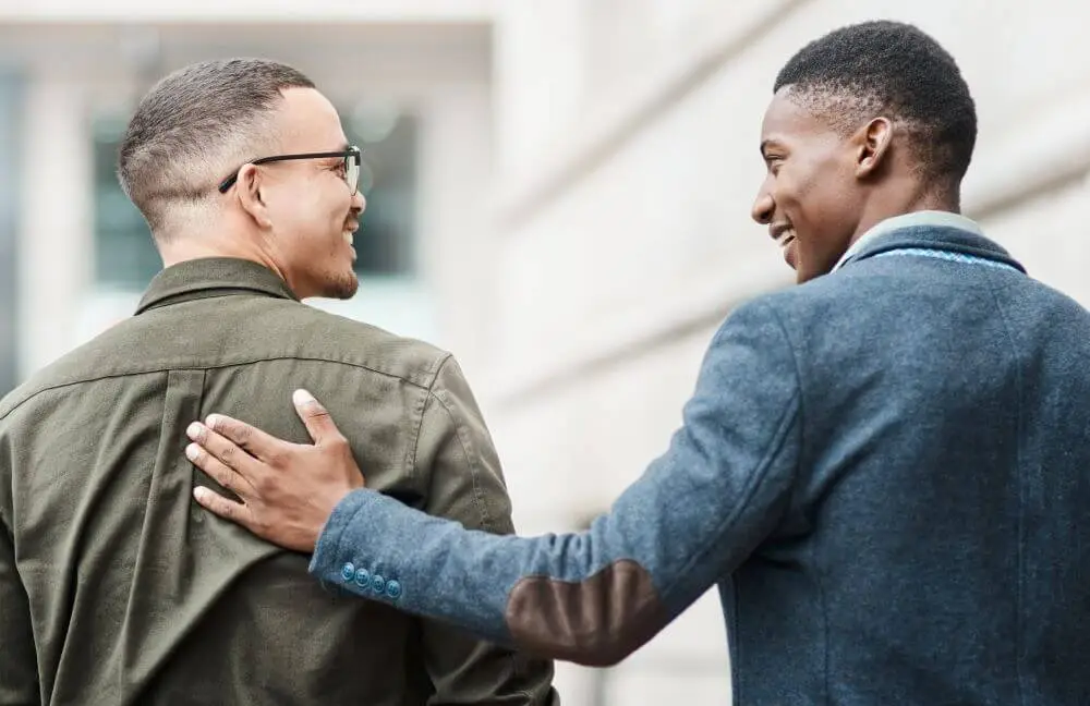 A man showing his support to a friend.