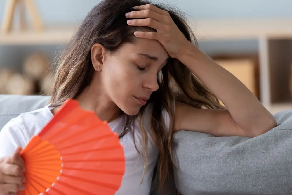 A woman dealing with depression during the summer months partly due to the extreme heat.