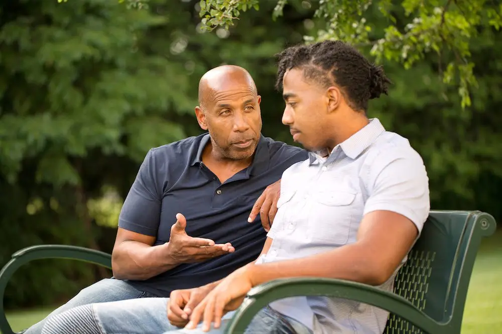 father talking to son about his behavior