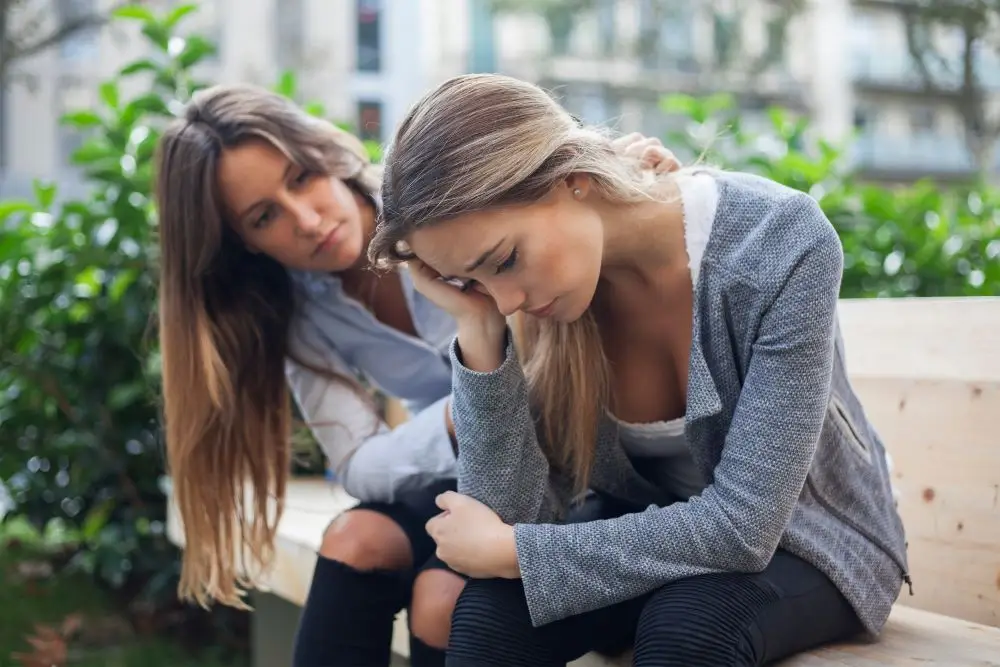 A woman supporting her friend who is experiencing a depressive episode.