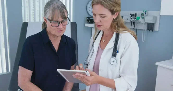 Woman talking to her doctor about her mental and physical health