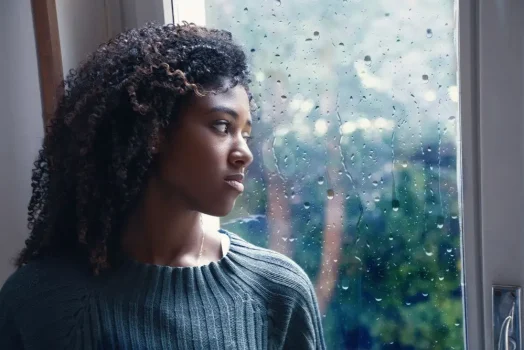 A woman struggling with depression during the fall and winter months because of the constant coverage of rain in her city.